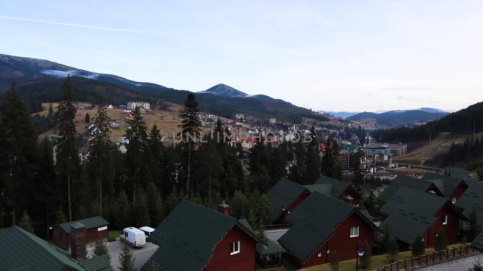 Bukovel ski resort in autumn aerial view. View of hotel houses in the ecological countryside against the background of spruce trees and mountain hills.Ukraine, Bukovel - November 20, 2019