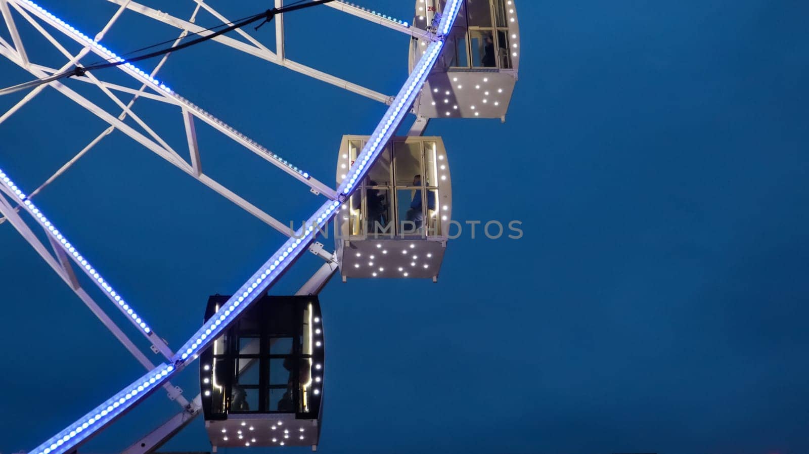 Ukraine, Kiev - January 15, 2019. Illuminated Ferris Wheel on Kontraktova Square in Kiev in the evening