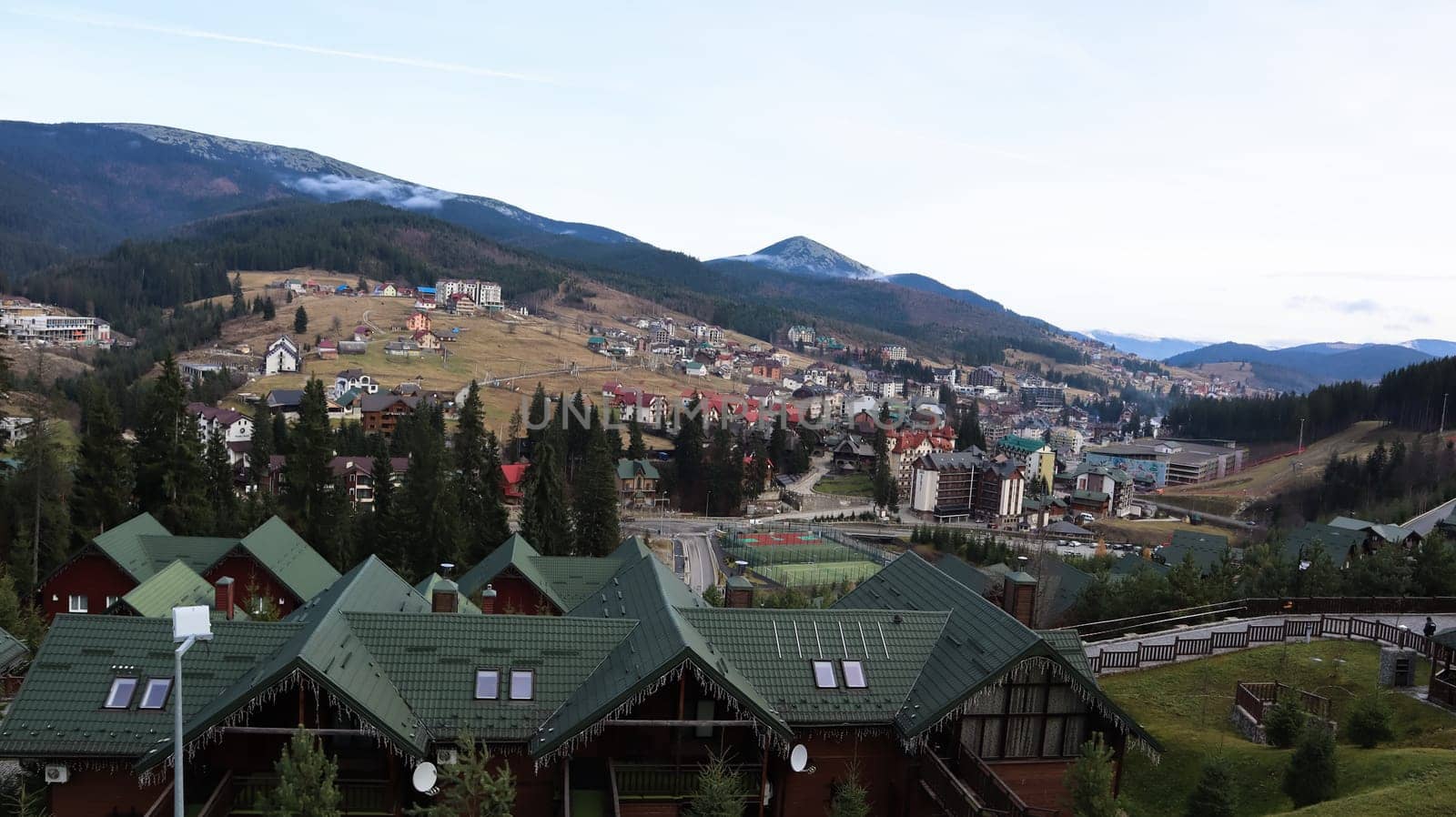 Bukovel ski resort in autumn aerial view. View of hotel houses in the ecological countryside against the background of spruce trees and mountain hills.Ukraine, Bukovel - November 20, 2019