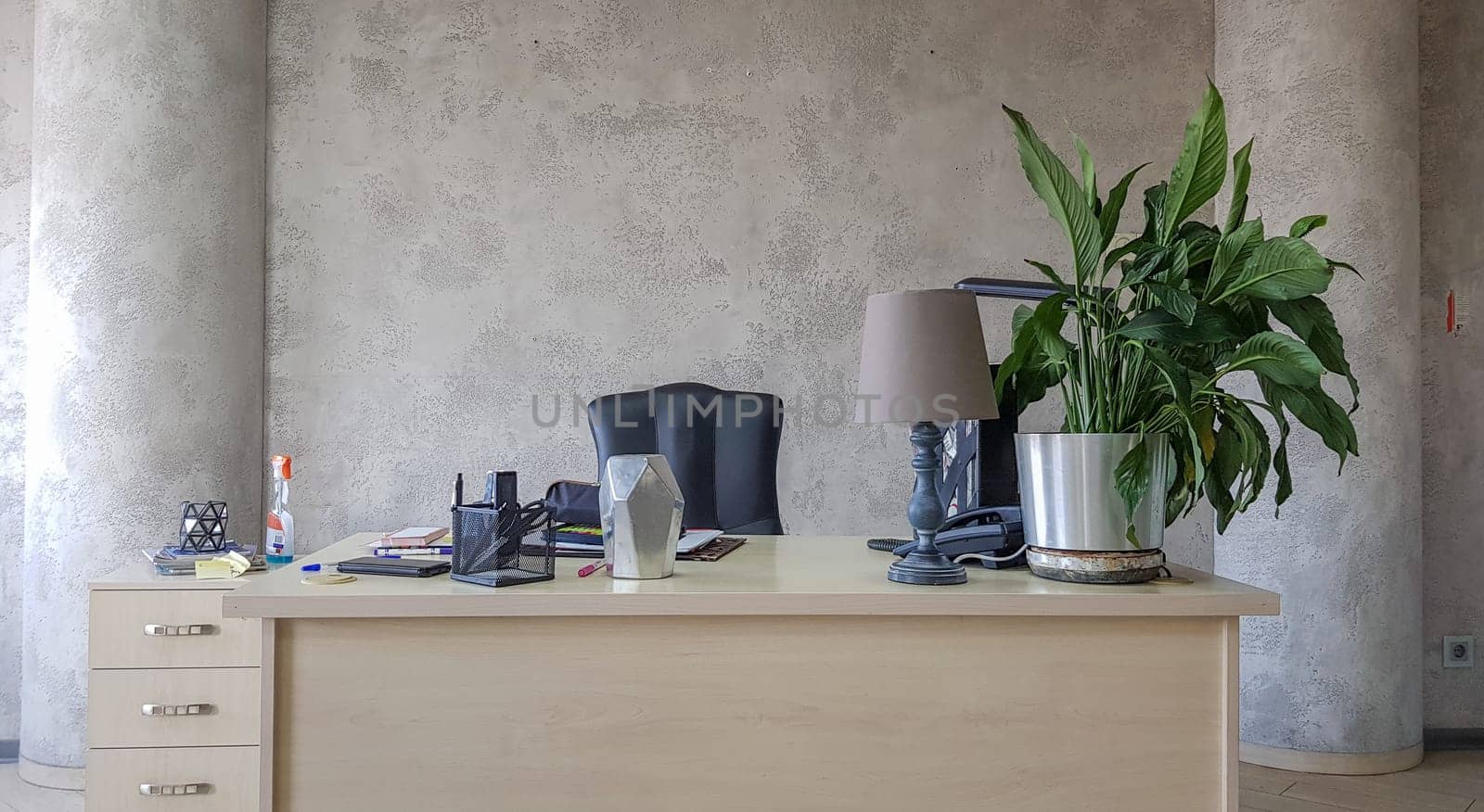 design of a workplace in the office with modern equipment and amenities on a gray wall background