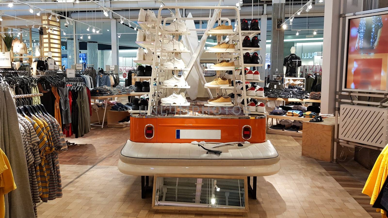Ukraine, Kiev - September 04, 2019. Interior of a branded store of fashionable clothes and shoes.