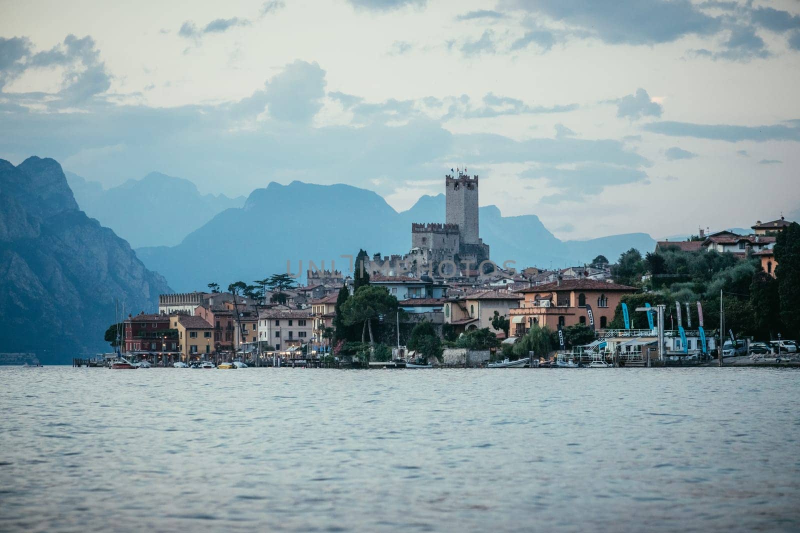 Landscape in Italy: Sunset at lago di garda, Malcesine: Lake, Clouds and village
