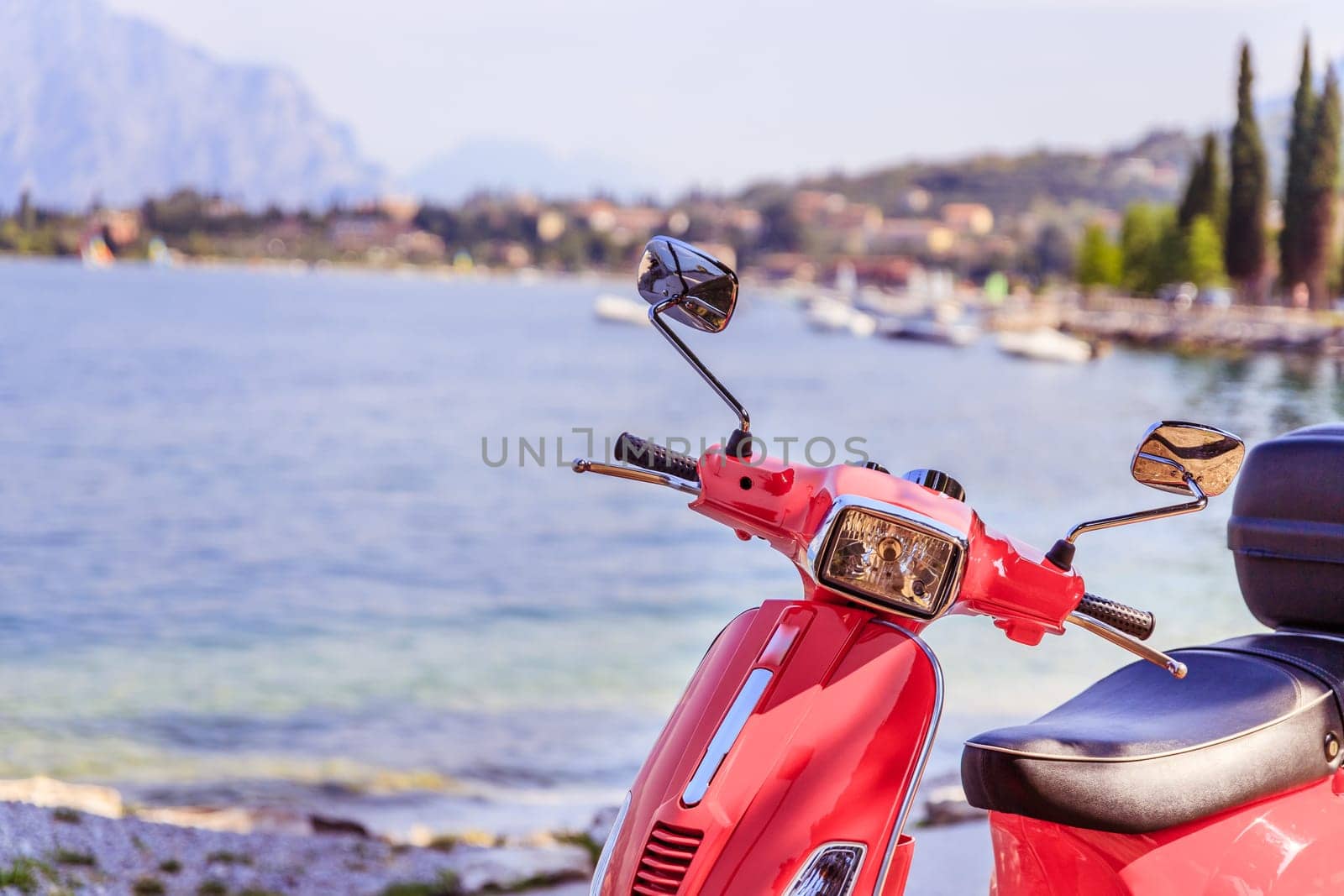 Beautiful red scooter on the beach, landscape and blue sky