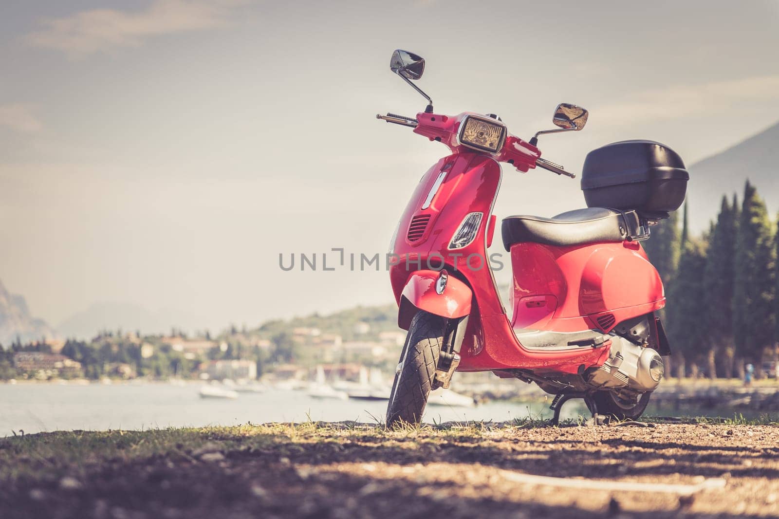 Beautiful red scooter on the beach, landscape and blue sky