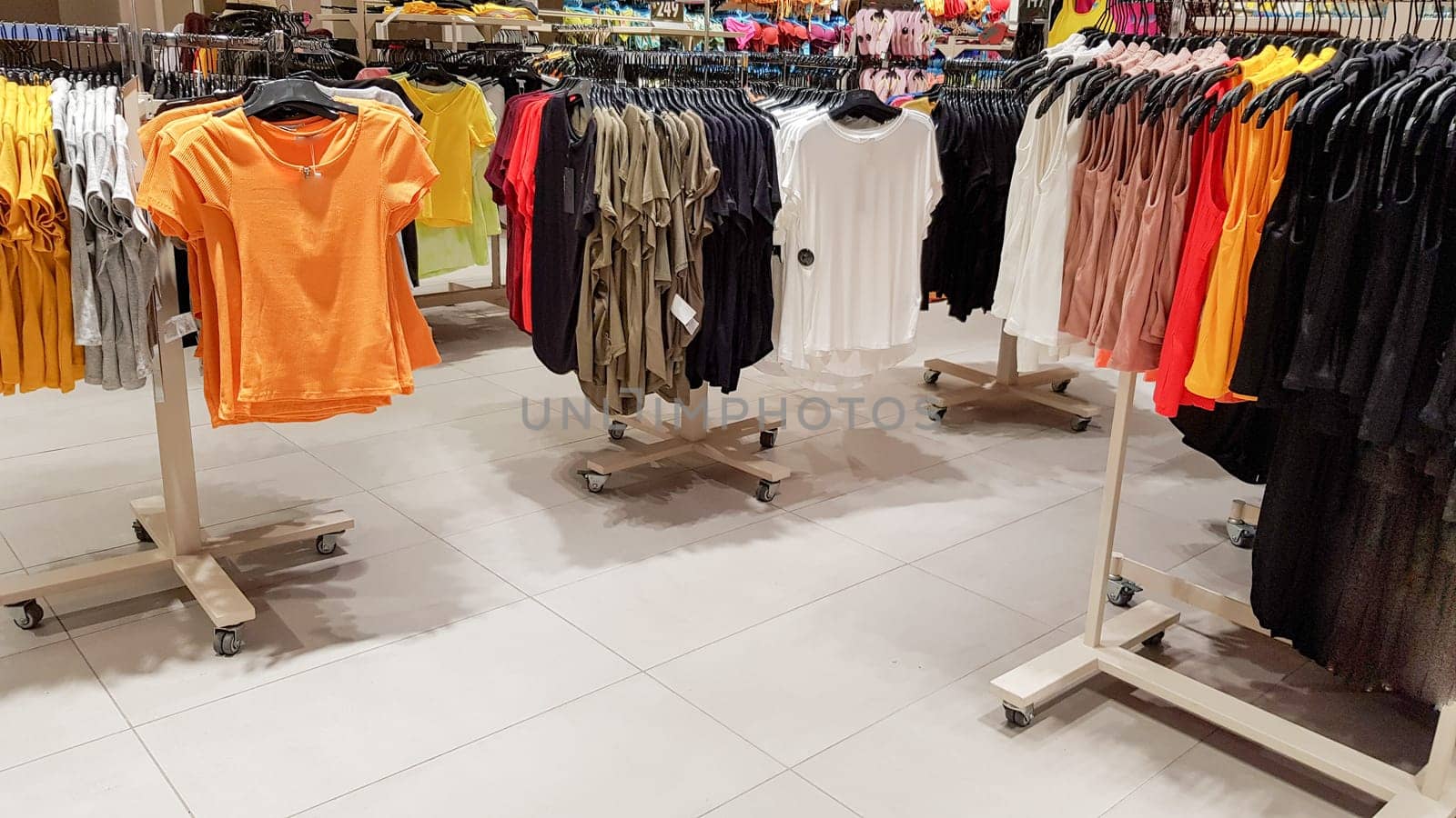 Ukraine, Kiev - September 04, 2019: A large clothing store, mannequins and many rows with hangers, a variety of sizes and colors. Black Friday, a day of shopping and sales at boutiques and malls.