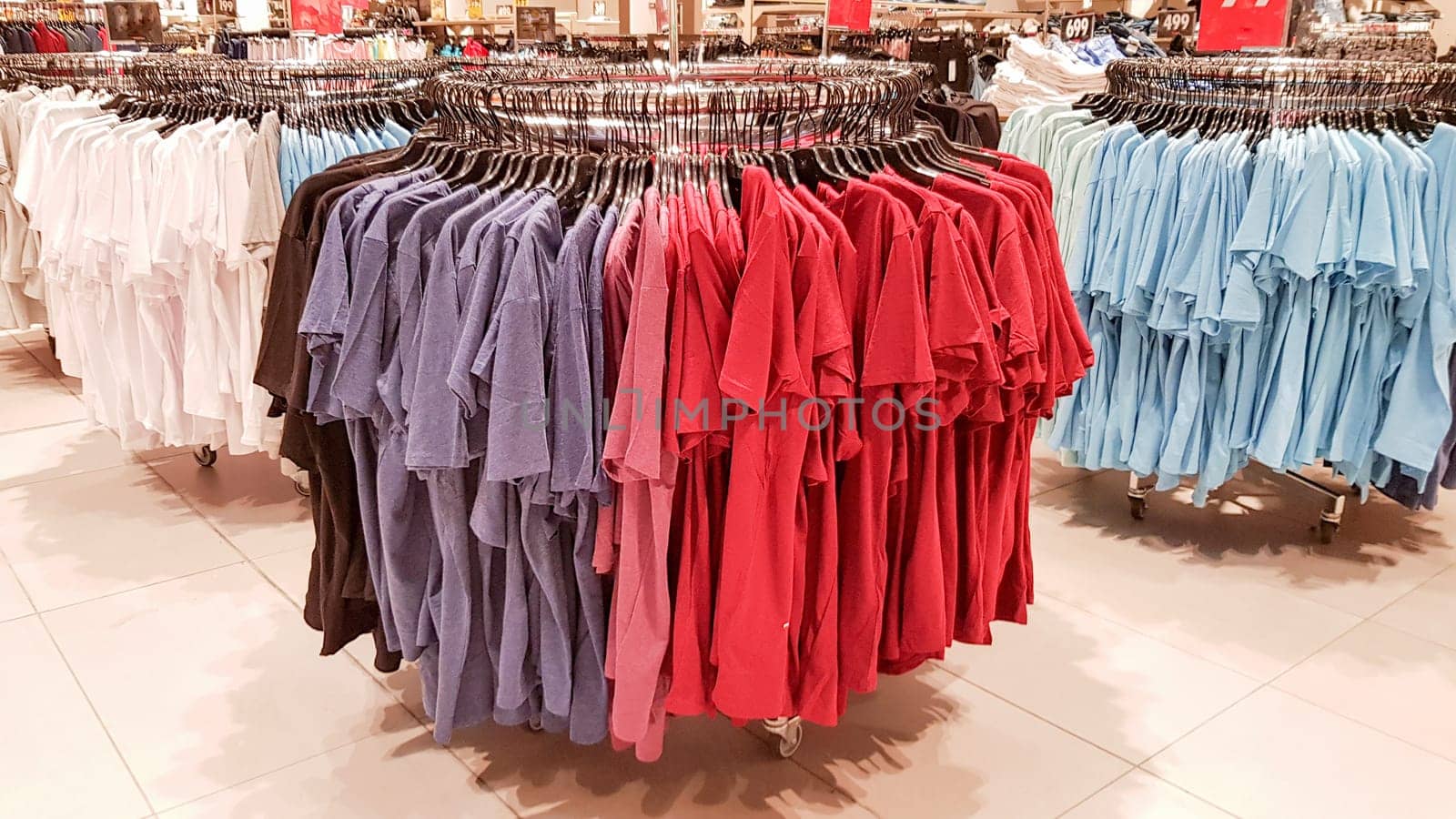 Ukraine, Kiev - September 04, 2019: A large clothing store, mannequins and many rows with hangers, a variety of sizes and colors. Black Friday, a day of shopping and sales at boutiques and malls.