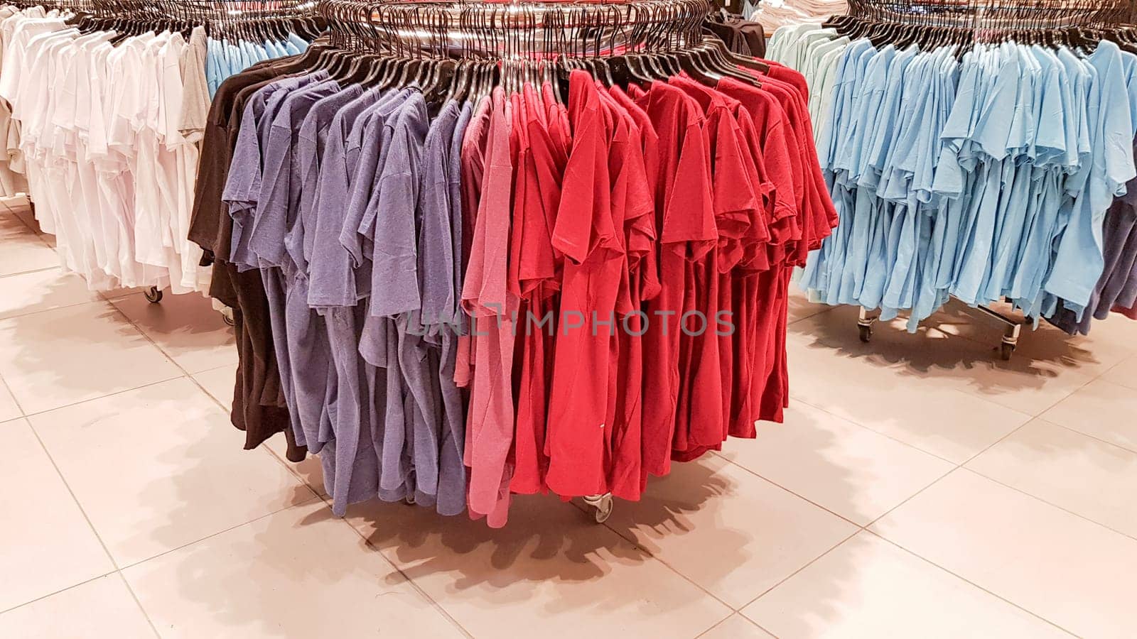 Ukraine, Kiev - September 04, 2019: A large clothing store, mannequins and many rows with hangers, a variety of sizes and colors. Black Friday, a day of shopping and sales at boutiques and malls.