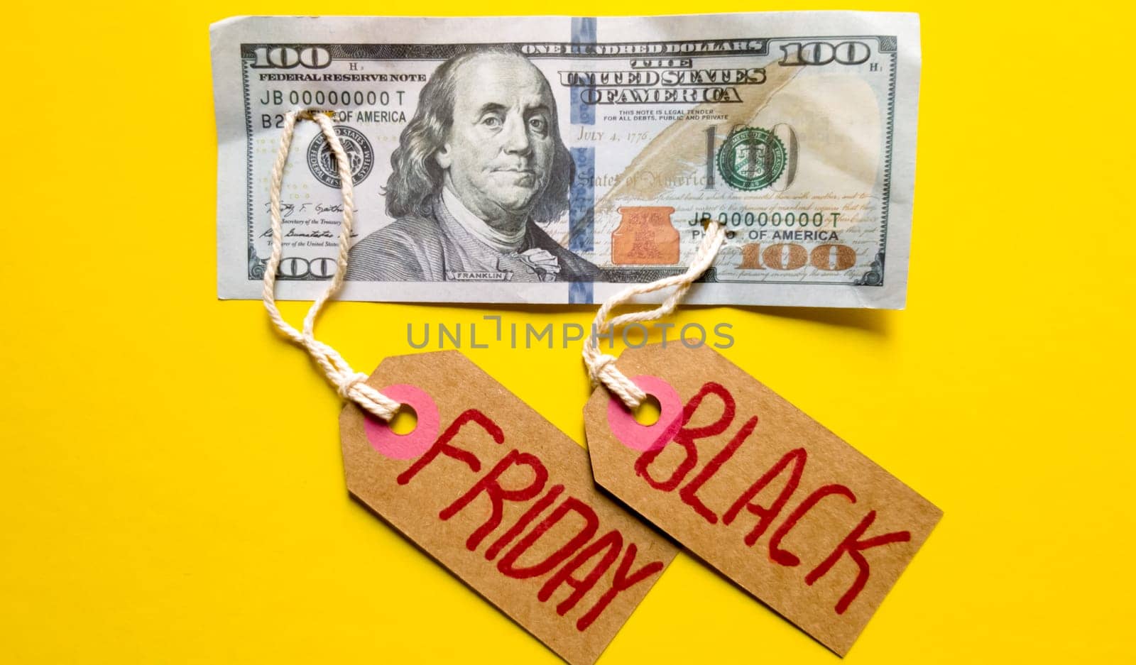 Black friday background, friday black text with money on a yellow background, copy space for text. Black friday sale text written on a notepad with a red pencil on a red background. Background, holiday concept. Black Friday - International day of shopping, promotions, discounts, sales. The sales season is the fourth Thursday of November. Copy space, place for text, flat lay.