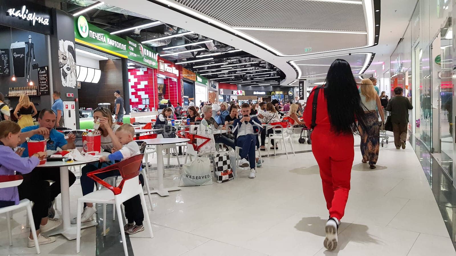 Ukraine, Kiev - September 04, 2019: crowded food court in a shopping center. People relax and eat at a food court in a shopping center.