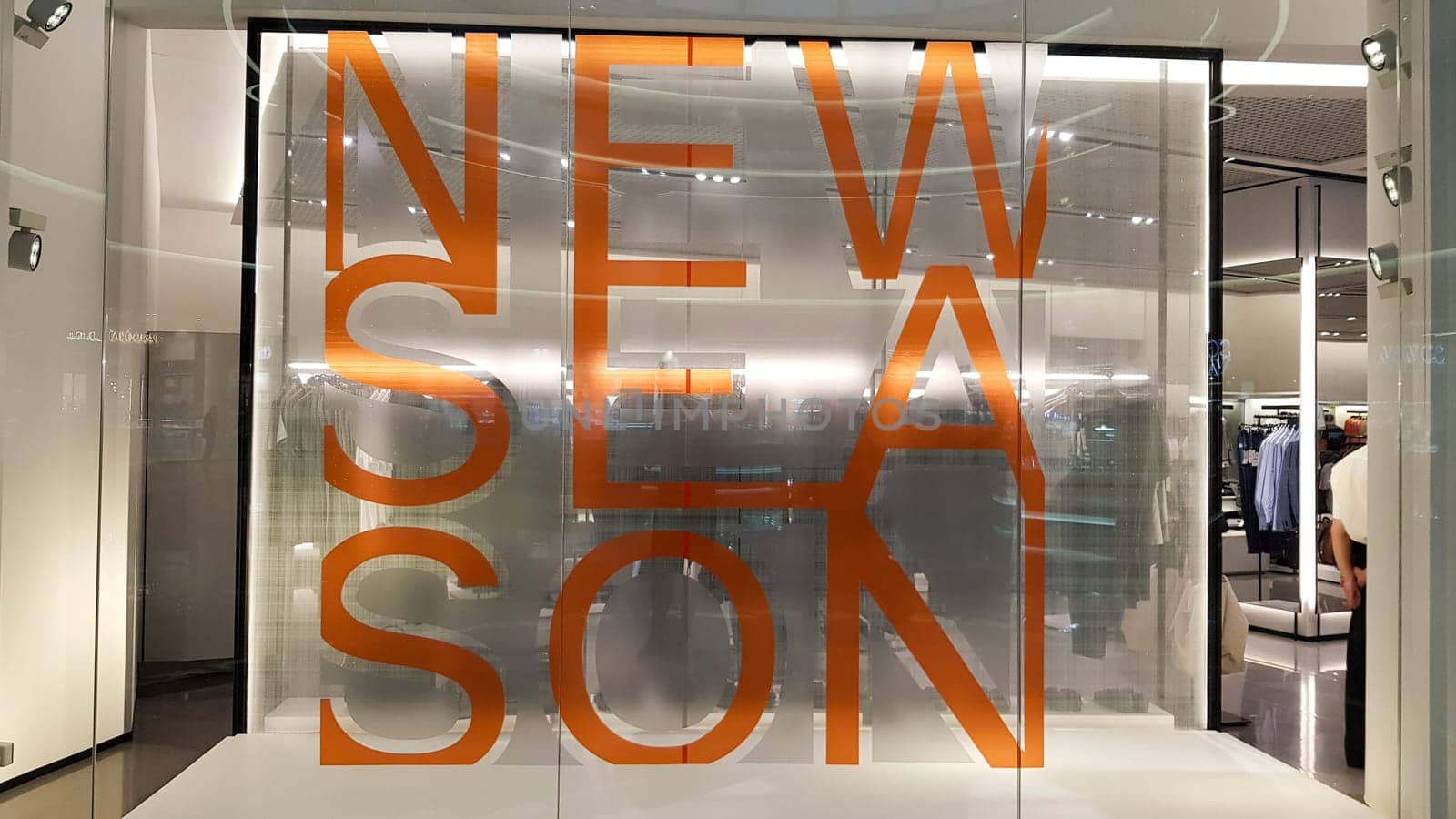 Ukraine, Kiev - September 04, 2019: Buyer of a clothing store window, written a new collection in capital letters in the foreground.