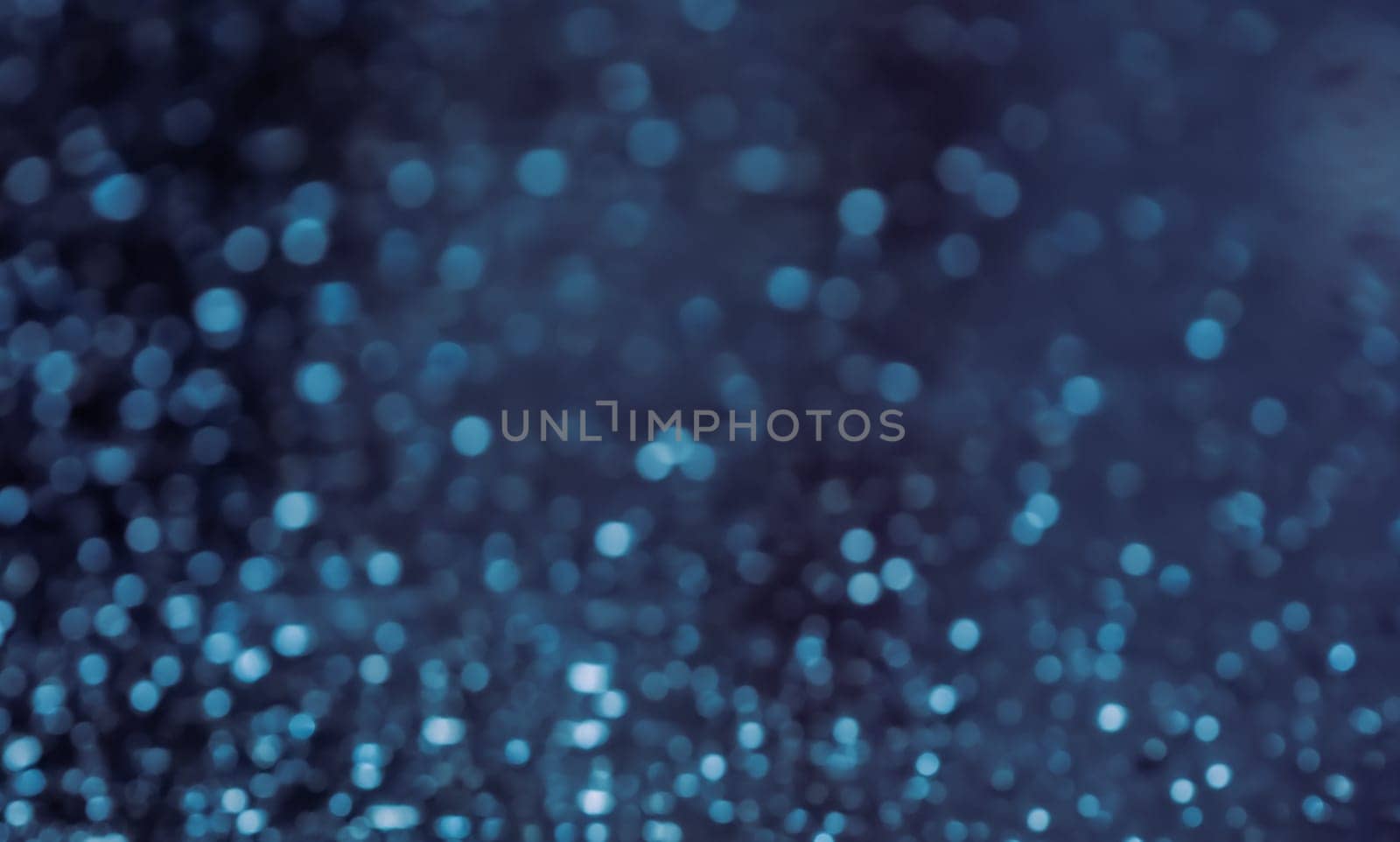 Close up of rain drops on the window in rainy night, cool lights