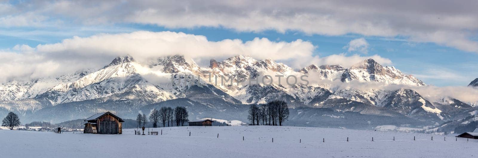 Snowy mountains, meadow and a hut, landscape in Austria, panorama