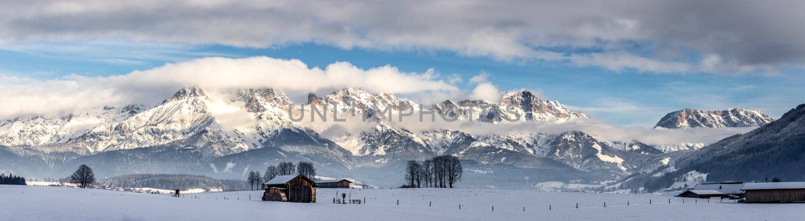 Snowy mountains, meadow and a hut, landscape in Austria, panorama