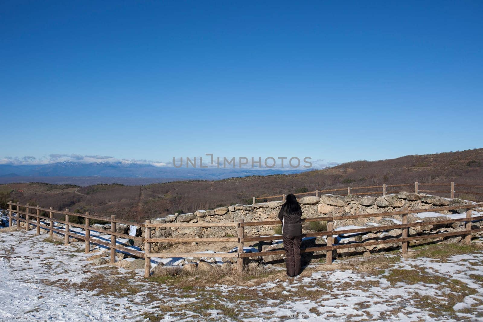 Visitor observing an old Corral de Lobos or Wolves trap. La Garganta, Extremadura, Spain