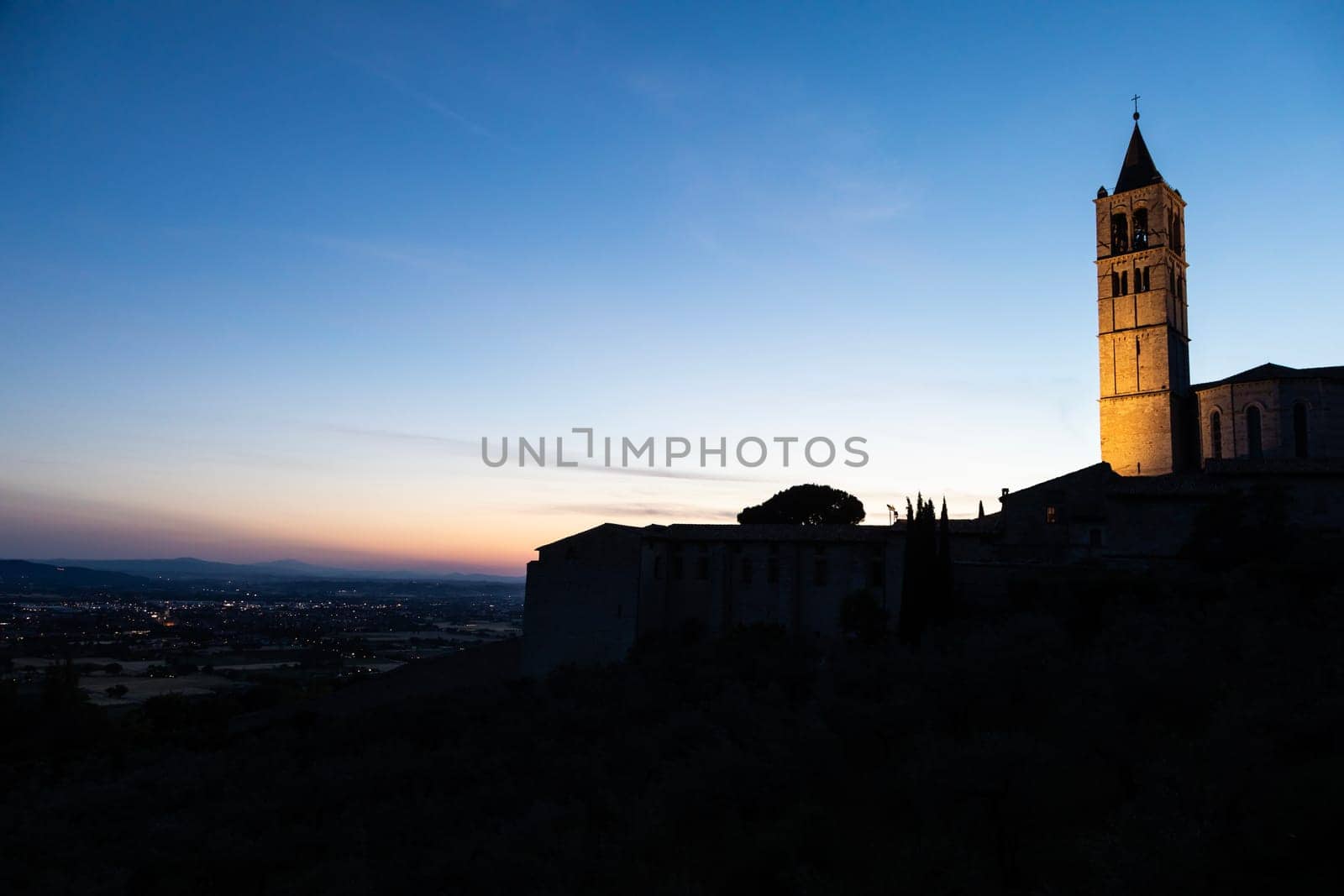 Church in Assisi village in Umbria region, Italy. The town is famous for the most important Italian St. Francis Basilica (Basilica di San Francesco)