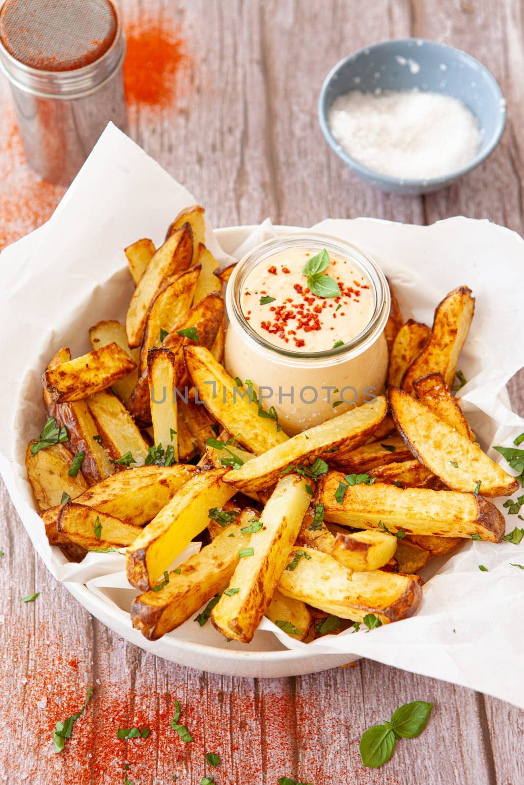 Homemade French fries, potato weddges with garlic dip