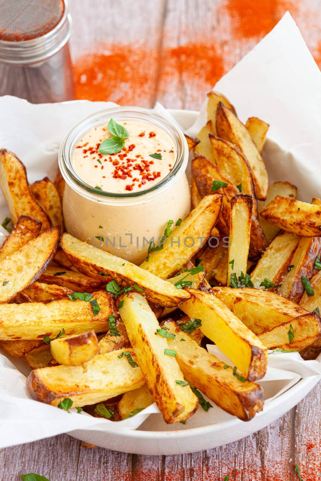 Homemade French fries, potato weddges with garlic dip