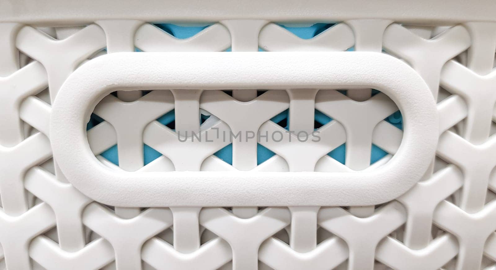Plastic containers of different colors and prices are placed in a warehouse or store on display racks. Recycled plastic for sale, many choices.