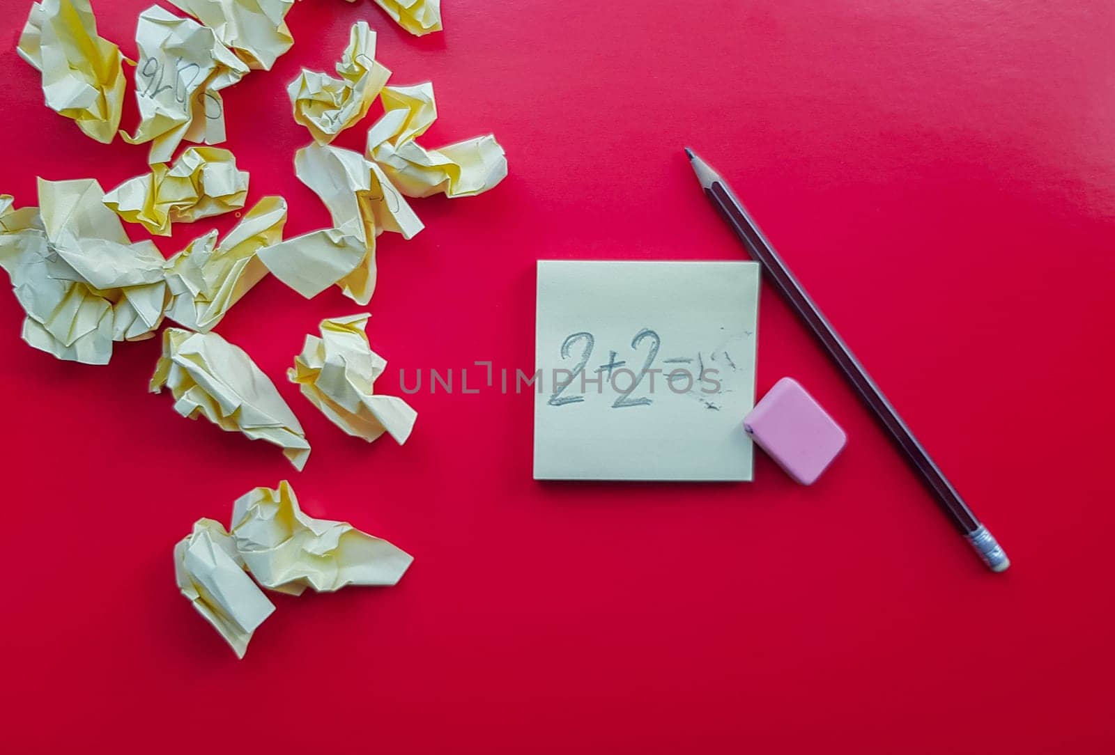 Yellow sticky note reminder on red background with pencil, empty place for text