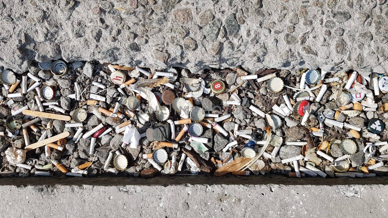A lot of cigarette butts. The cause of lung cancer. Many used cigarette butts as trash.