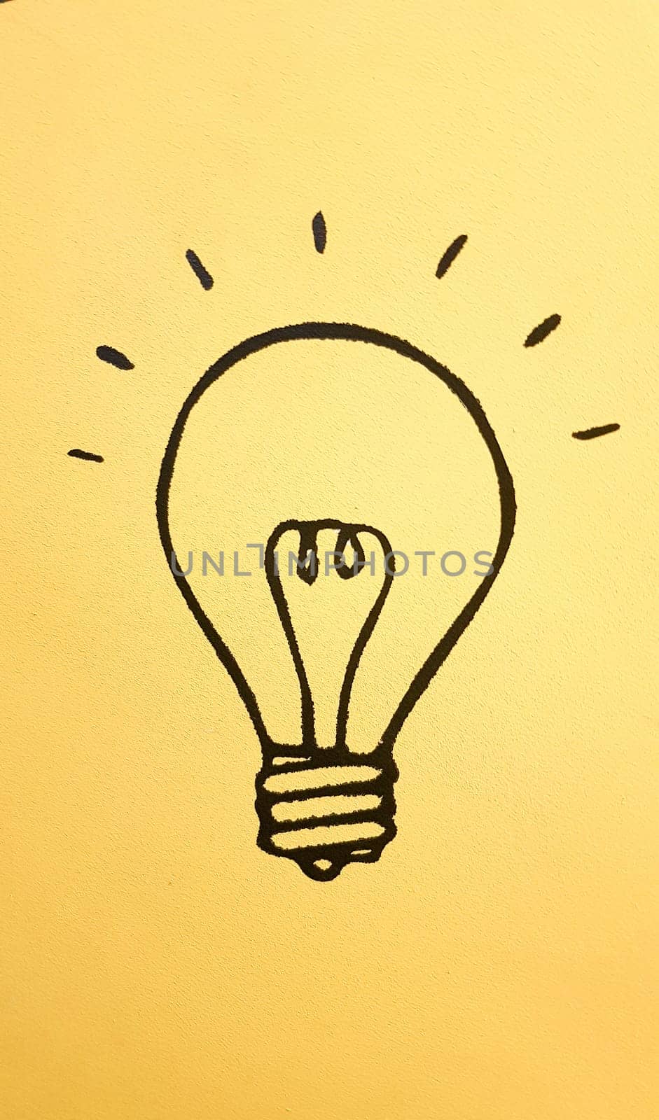 light bulb icon representing ideas, creativity and innovation in a colorful yellow banner background