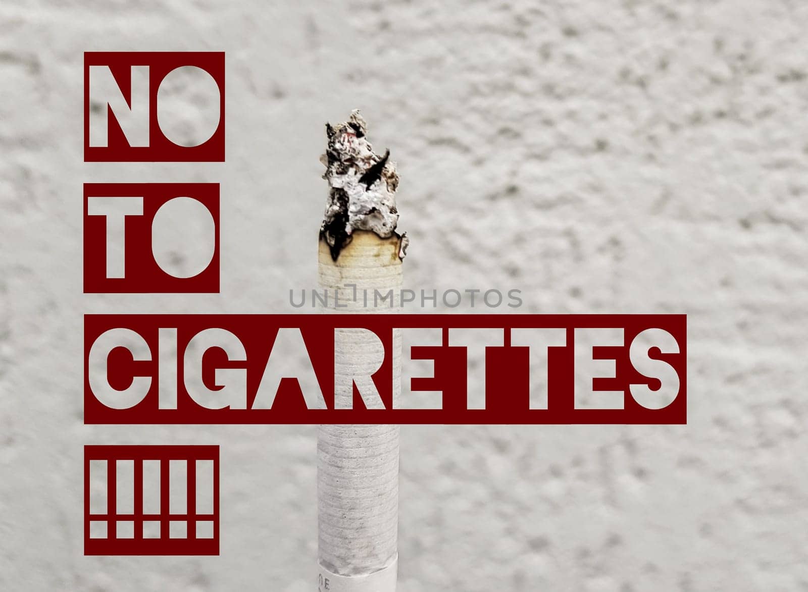 Secondhand smoke concept. On a tobacco-free day, smoking is undesirable for society. Vertical cigarette smoking on a white wall background with copy space. Text no to cigarettes