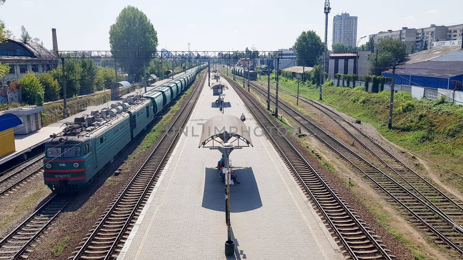 Ukraine, Kiev - June 16, 2019: Station with trains. The train stands at the railway station waiting for passengers in the daytime. Panorama, view from the bridge.