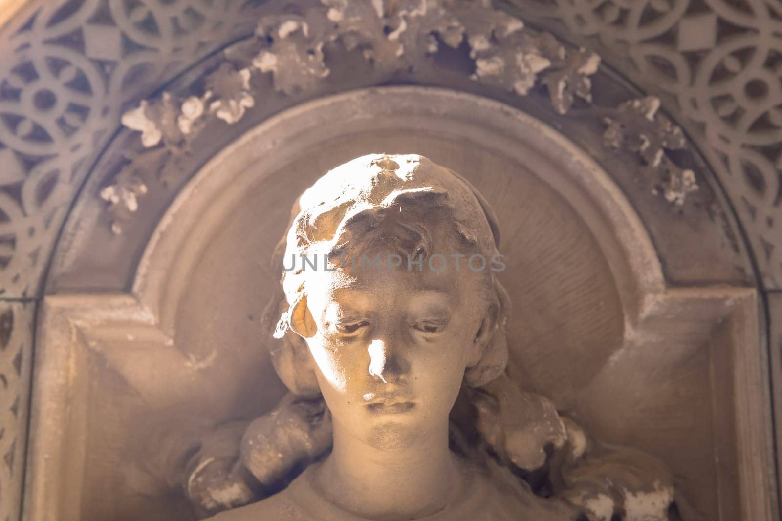 GENOA, ITALY - June 2020: antique statue, beginning 1800, made of marble, in a Christian Catholic cemetery - Italy