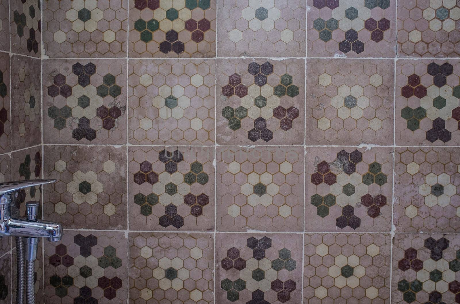 Vintage rural hotel bathroom covered with recycled cement tiles. Rural tourism concept