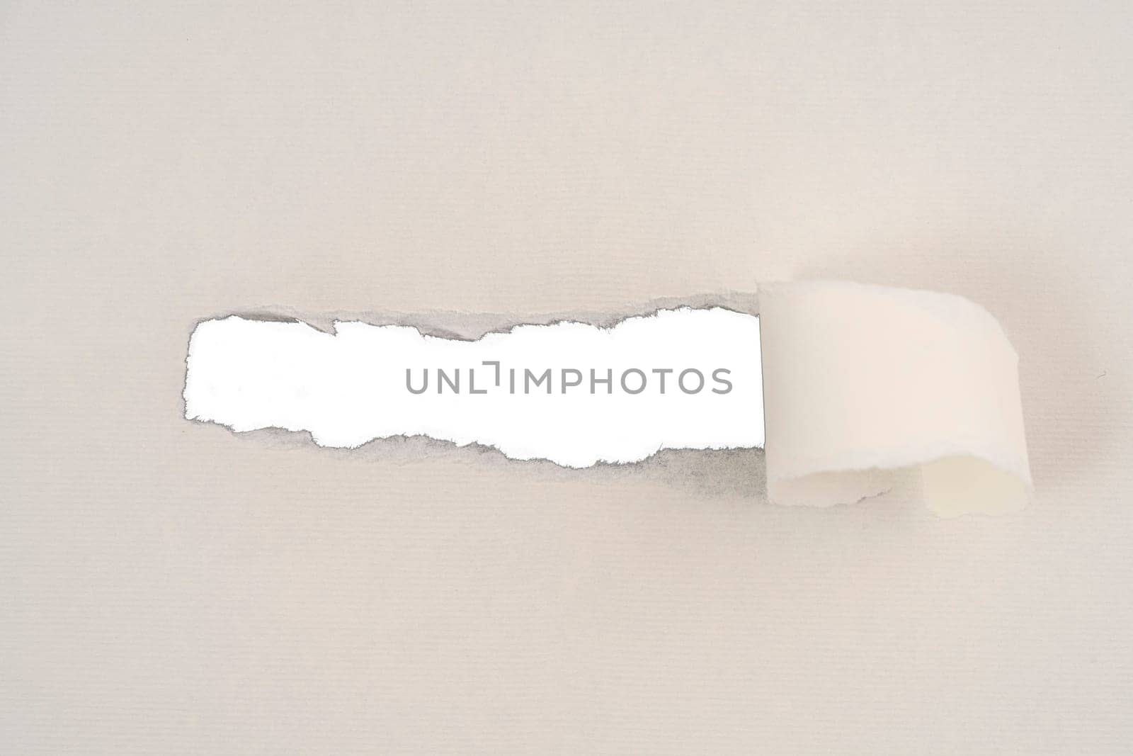 a strip torn from a cardboard that leaves room for an inscription
