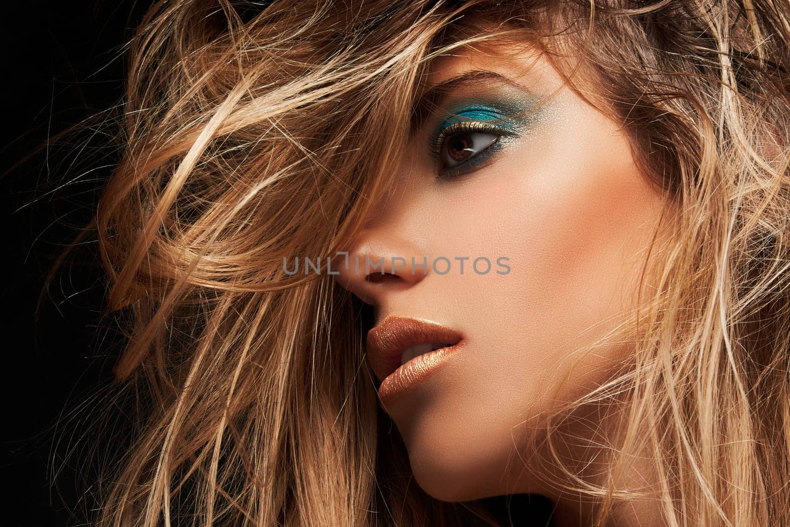 Beauty closeup portrait of young sexy woman against dark background, beauty and makeup concept.