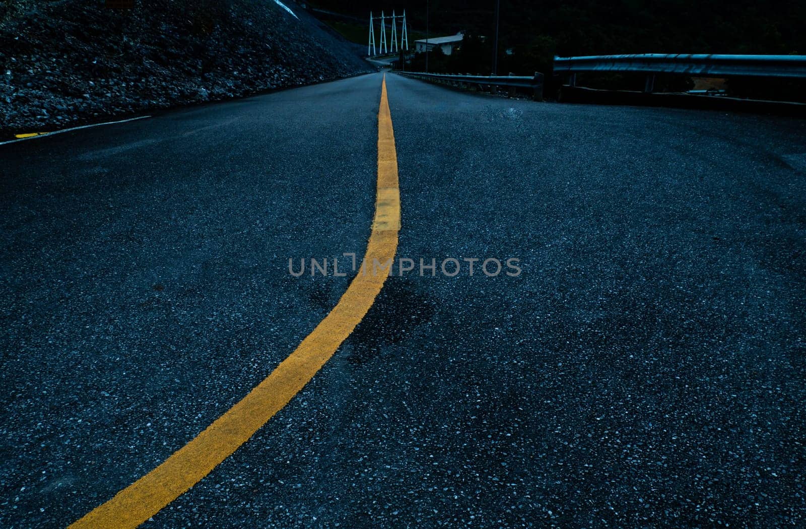 Asphalt road with yellow line curve. Black and yellow asphalt road, Road curve, Road Background, angle, highway, material. Curved Road With Yellow Line.
