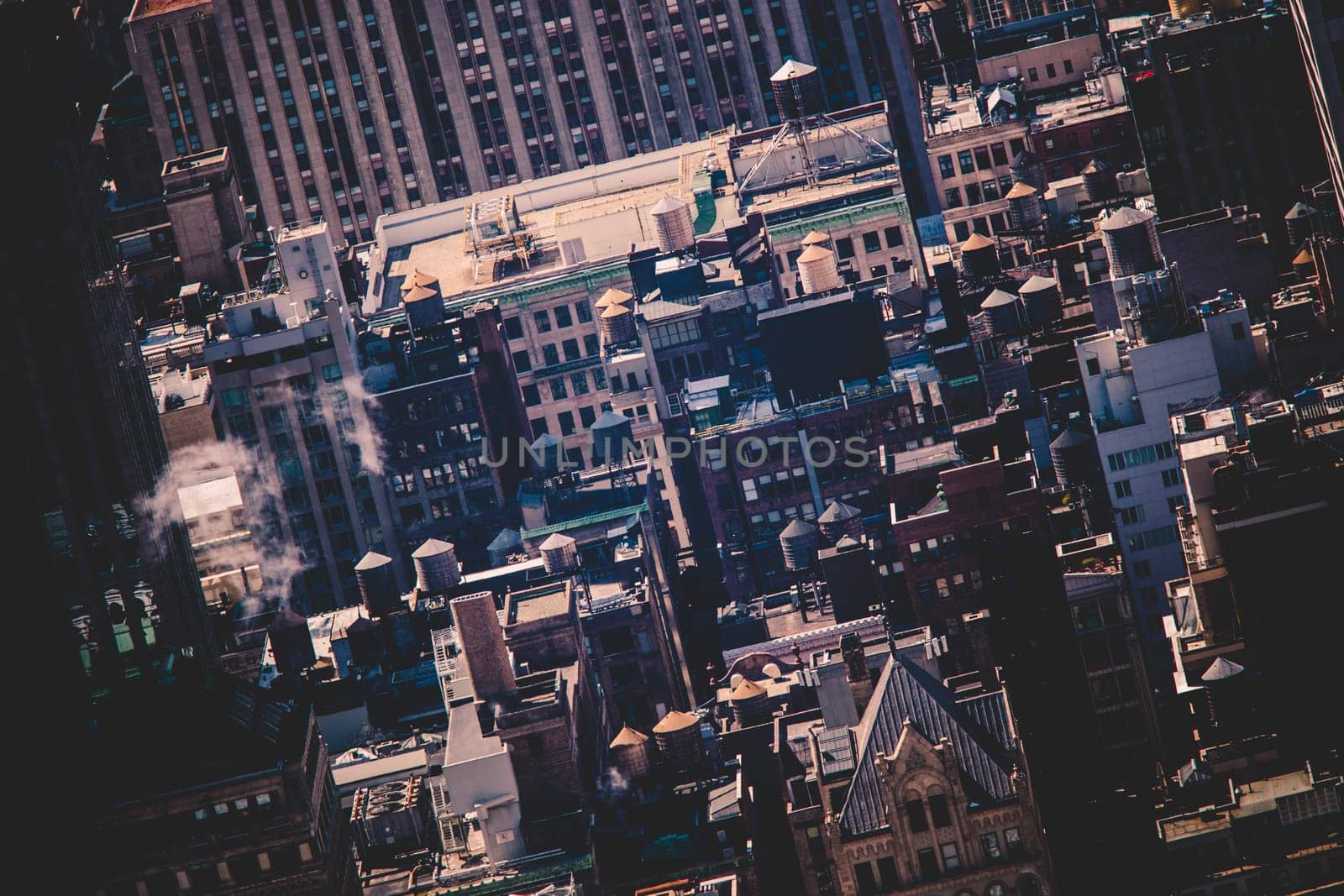 New York City, USA. Midtown Manhattan building rooftops with steam comming from the heating systems.