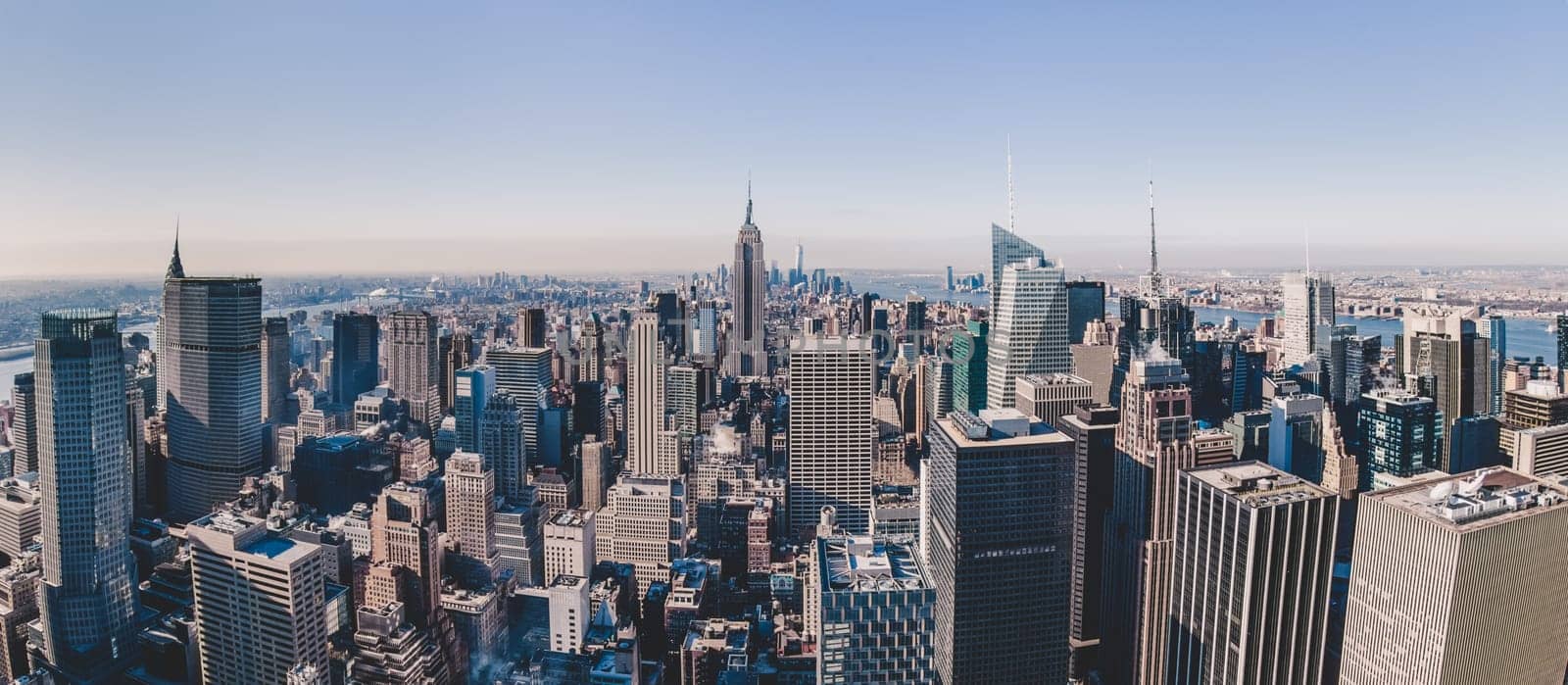 Panoramic view of New York City. Manhattan downtown skyline with Empire State Building and skyscrapers.