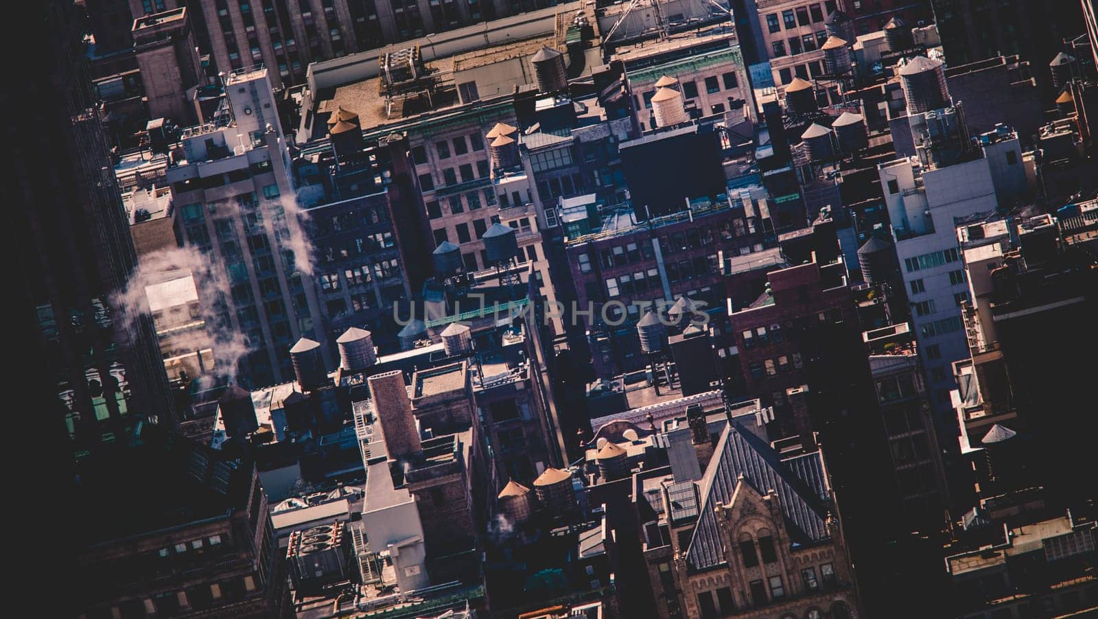 New York City, USA. Midtown Manhattan building rooftops with steam comming from the heating systems.