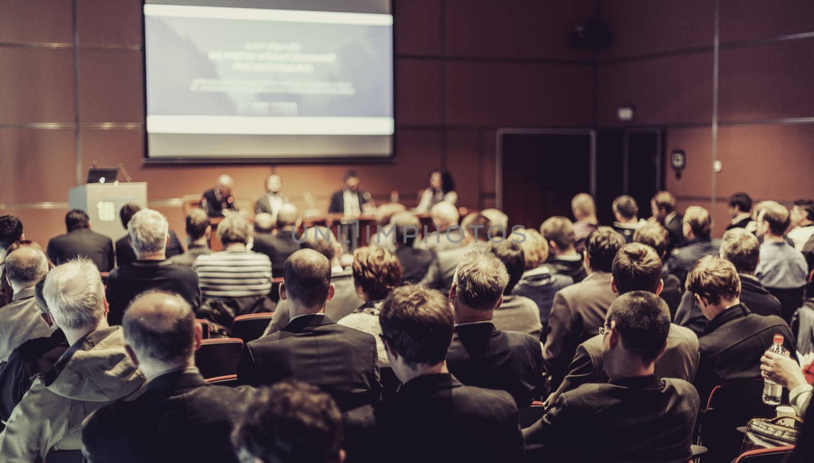 Round table discussion at business convention and presentation. Audience at the conference hall. Business and entrepreneurship symposium.