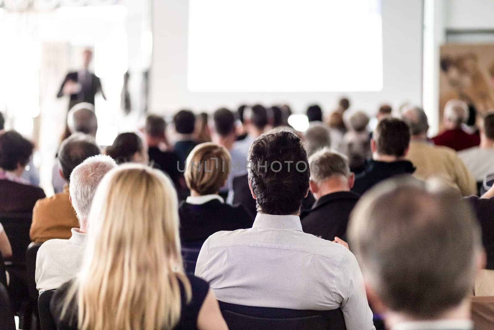 Speaker Giving a Talk at Business Meeting. Audience in the conference hall. Business and Entrepreneurship.