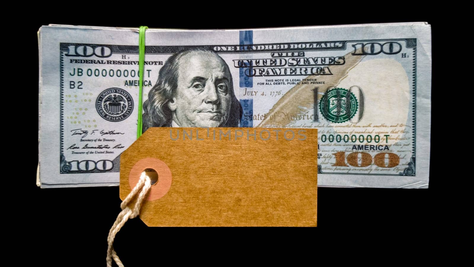 Empty cardboard tag for inscription black friday with american dollars on black background. Background, concept for the holiday Black Friday - the international day of shopping, stocks, discounts, sales. Sales season on the fourth Thursday of November. Copy space, place for text, flat lay.