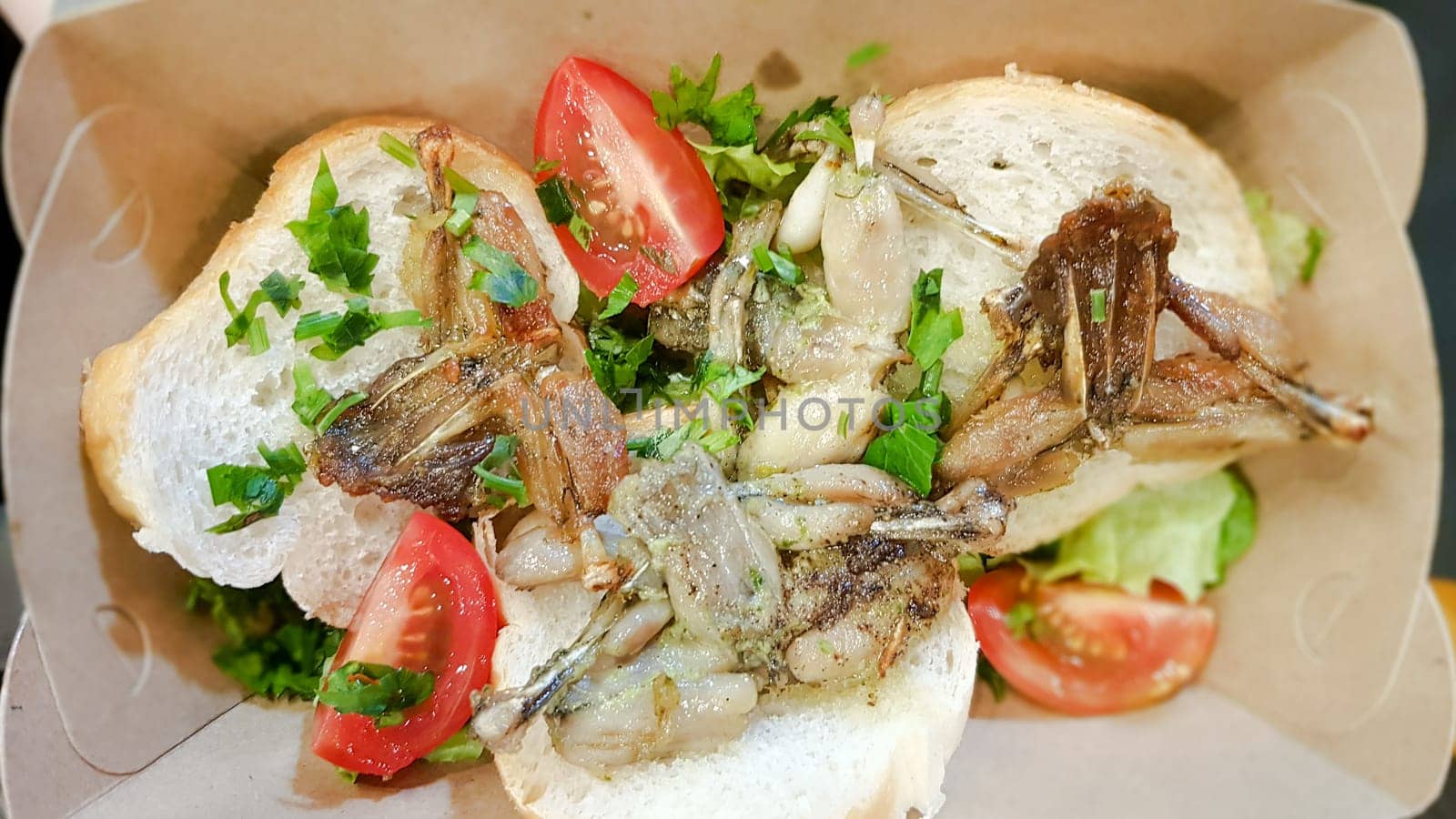 Cambodian dish grilled frog. Tasty exotic dishes are served in the restaurant. Street food frog legs.