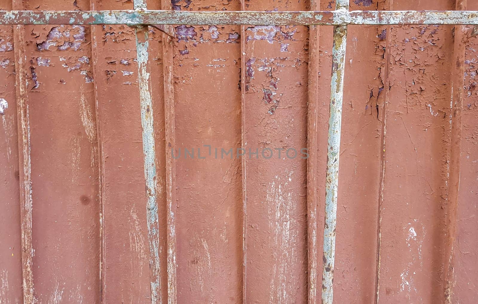 Texture of the old concrete wall for background. Reinforced concrete with damaged and rusty metal fittings.