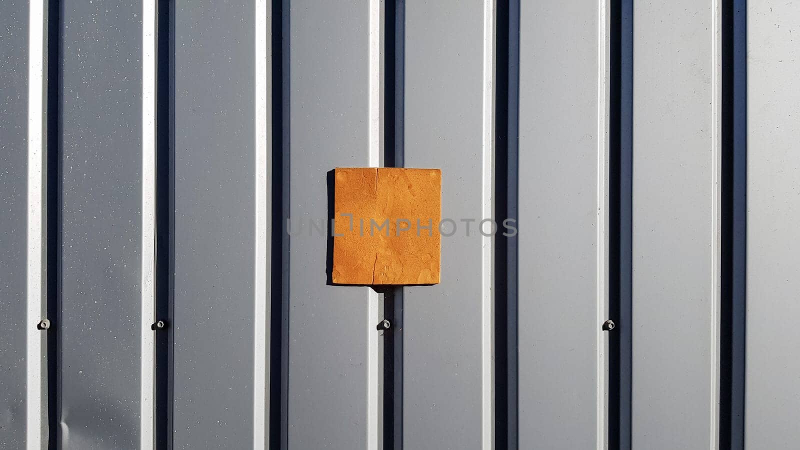 Metal sheet for roofing and background wall. Curve metal texture, table of steel sheet. Selective focus Texture for art backdrop add text or graphic design. Corrugated metal sheet door in silver.