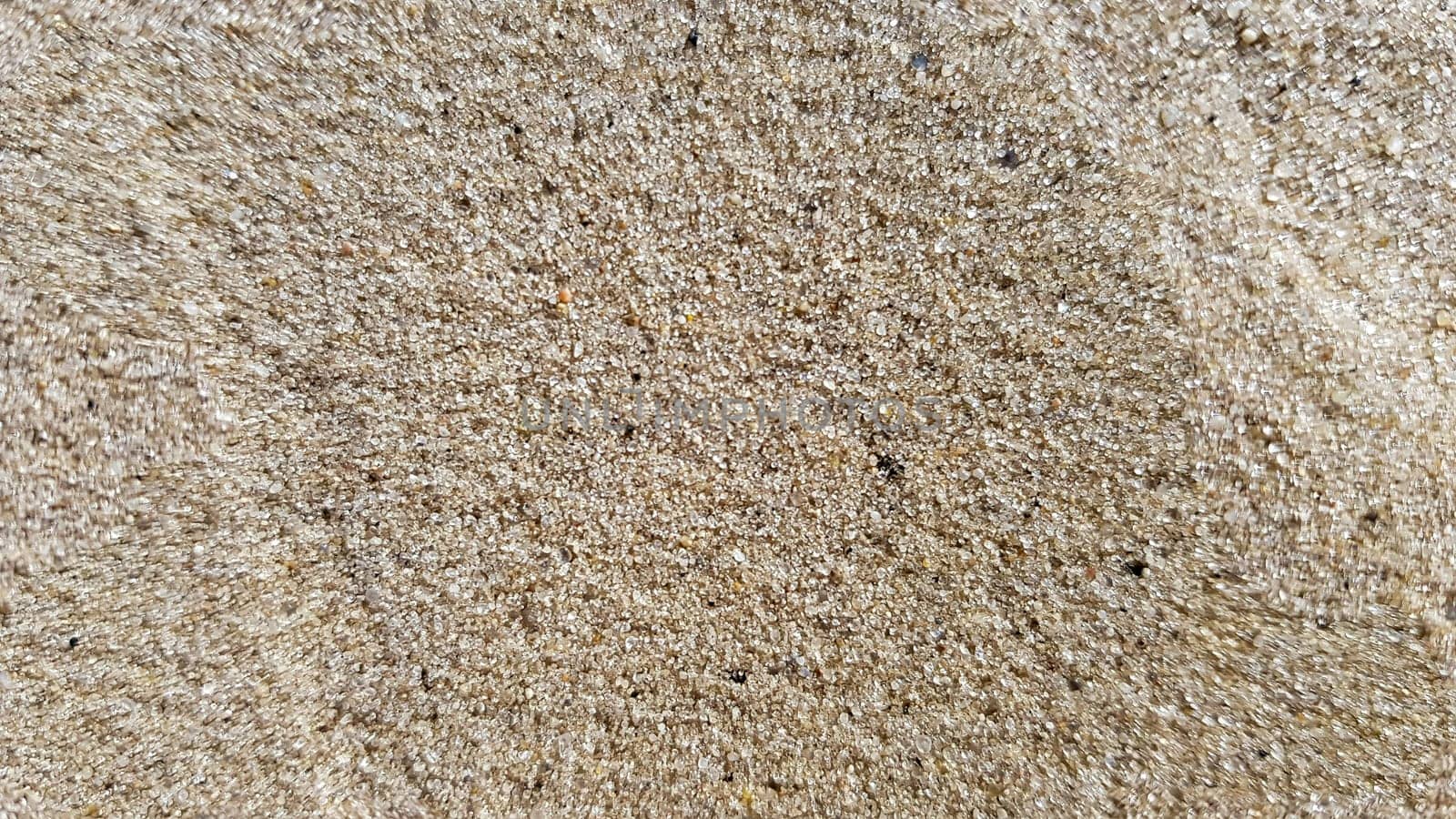 Top view of the sandy beach. Background with copy space and visible sand texture. Background of fine sand. Sand background.