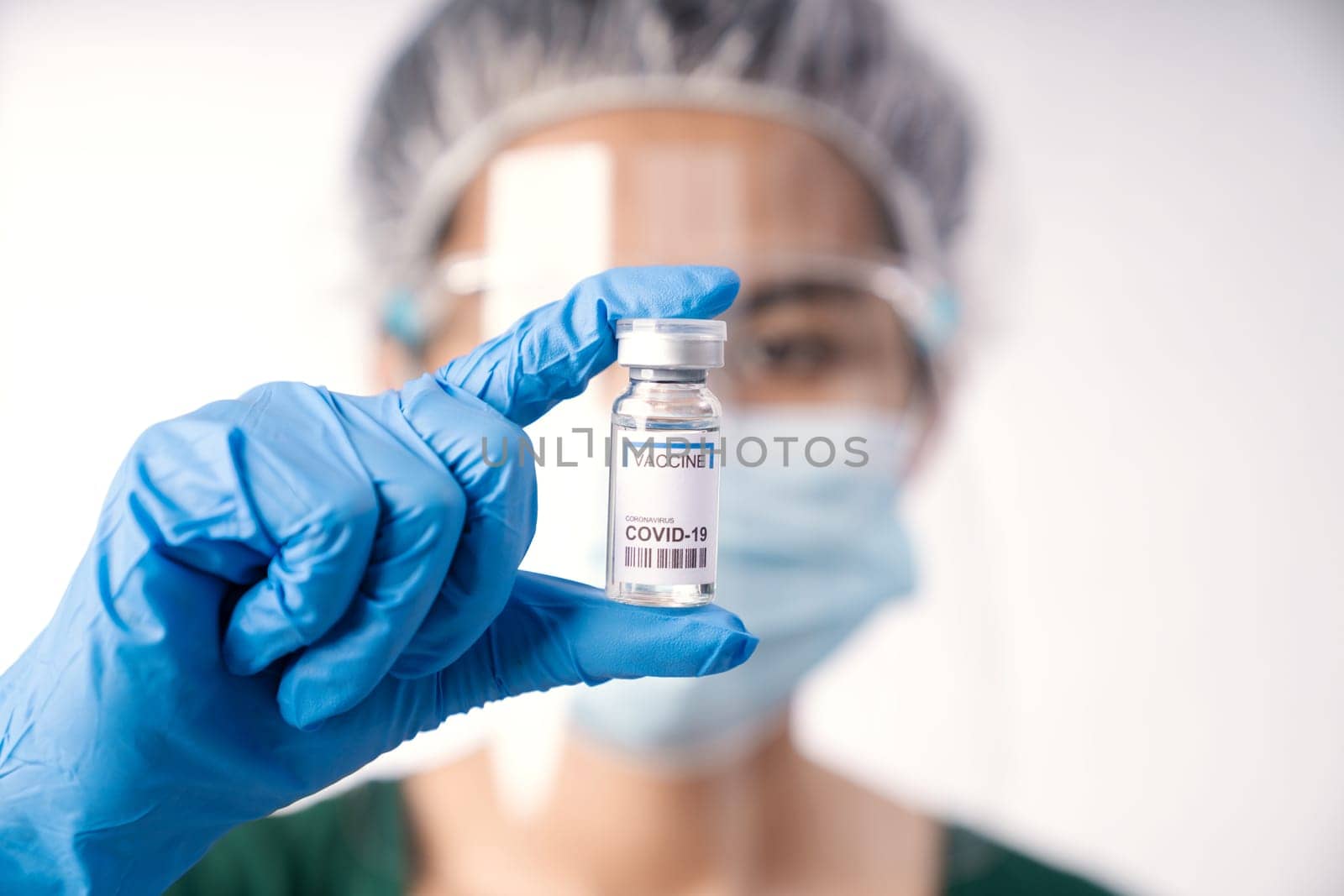 close-up scientist holding vaccine coronavirus in lap
