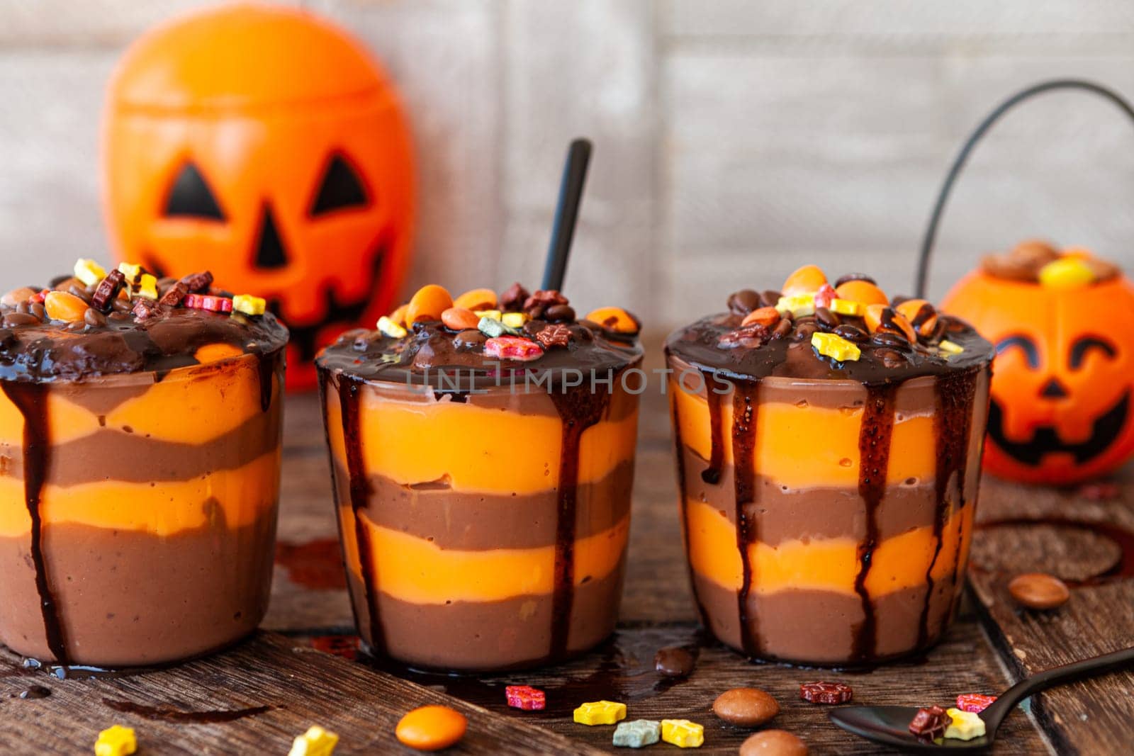Colorful pudding dessert with sugar sprinkles for Halloween