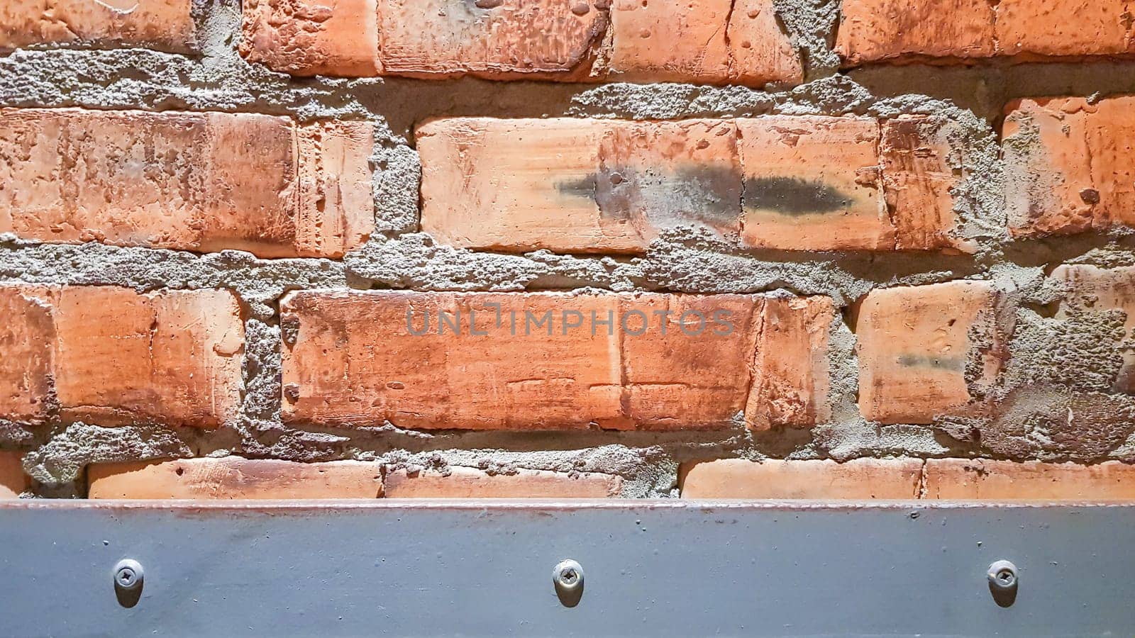 Vintage brick wall background. The red clay brick is beautiful, strong,suitable for decoration as a folk wall, used as a background image