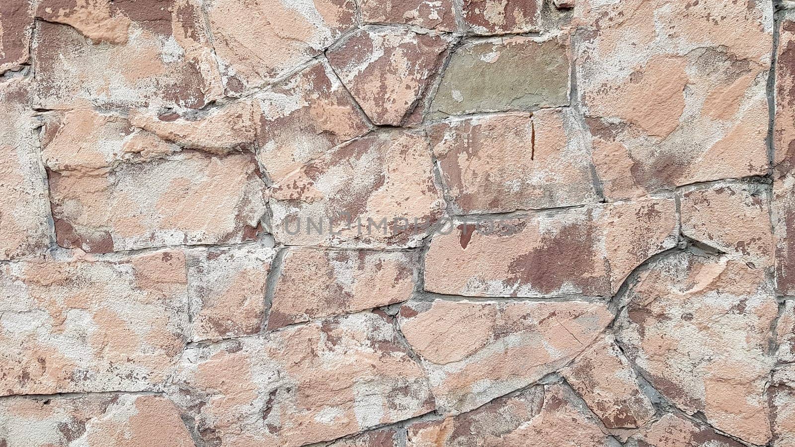 Gray stone wall background. The texture of the stone. Old castle wall background. Stone wall as a background or texture. Part of the wall, for background or texture