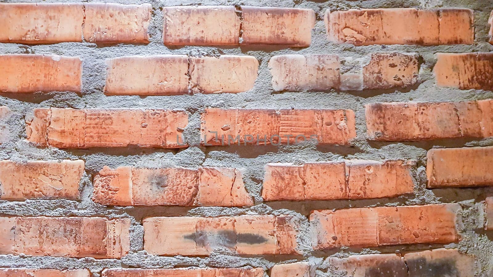Vintage brick wall background. The red clay brick is beautiful, strong,suitable for decoration as a folk wall, used as a background image