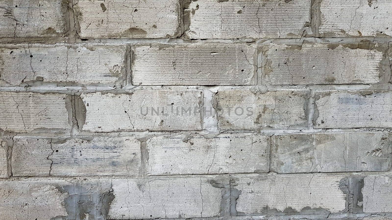 Gray stone wall background. The texture of the stone. Old castle wall background. Stone wall as a background or texture. Part of the wall, for background or texture