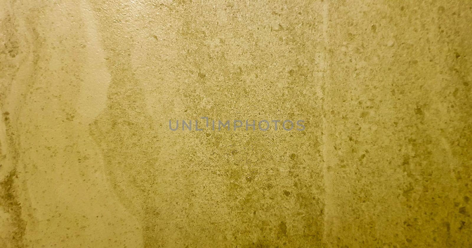 Gold background or texture and gradient shadow. wall and floor gold yellow mosaic tiles texture background. Metal texture background in gold.Panorama gold texture.