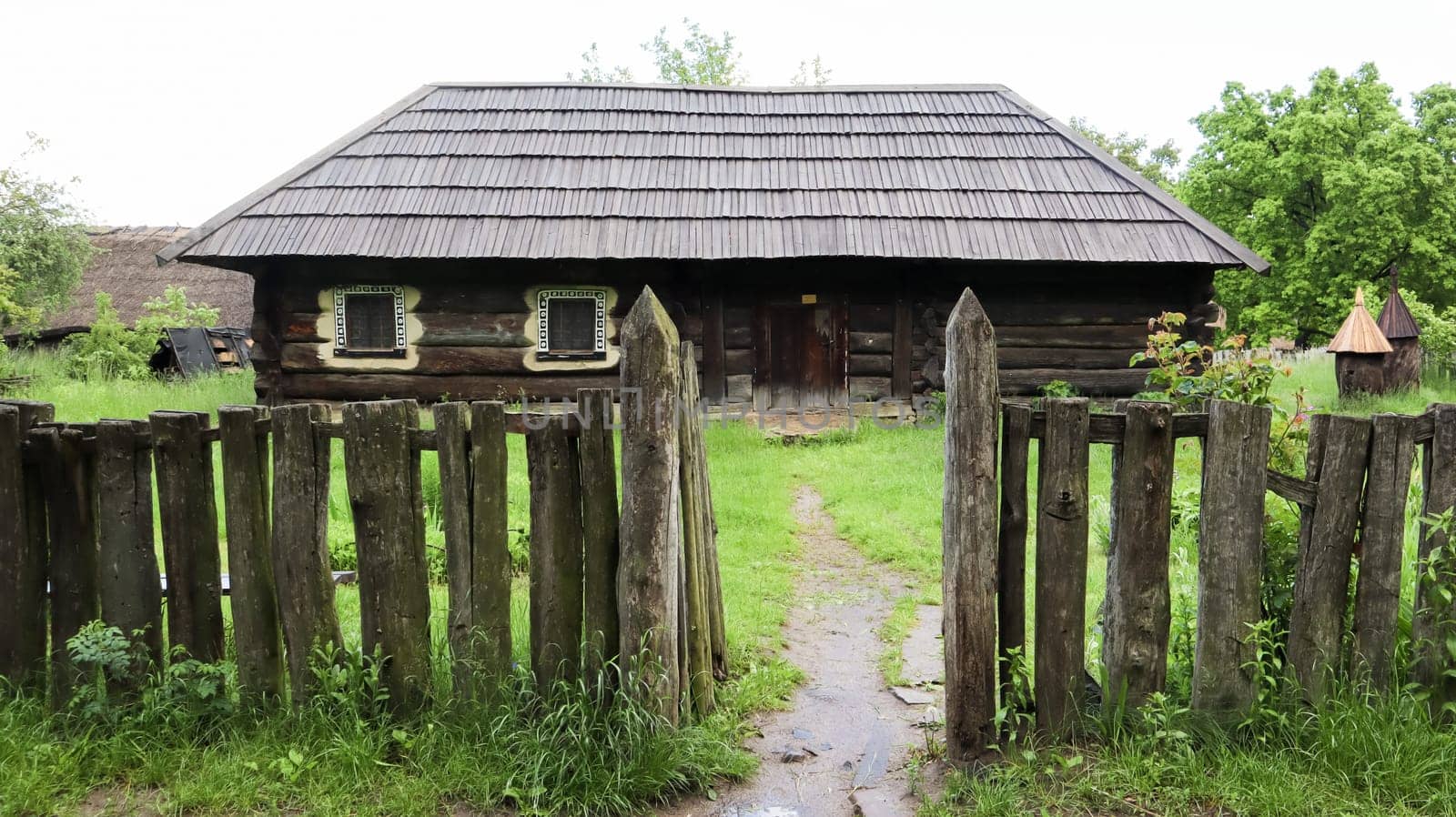 Ukraine, Kiev - June 11, 2020. The old house of peasants in the museum Pirogovo. National Museum of Folk Architecture and Everyday Life of Traditional Folklore Houses of Different Regions of Ukraine.